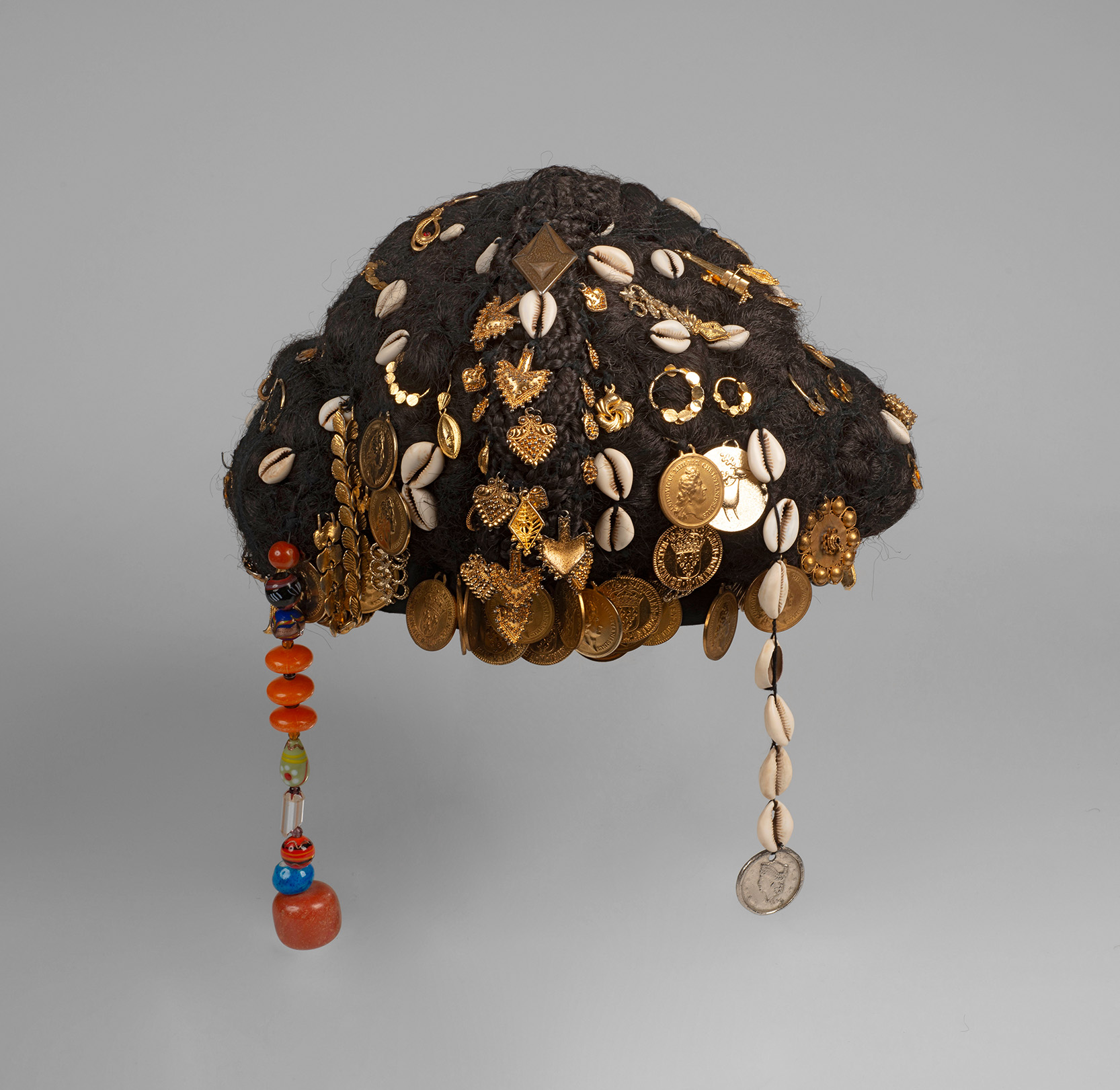 Haute Couture wig by Oumou Sy; Senegal, Dakar; 1995; made of textile, metal, cowri shells, beads; WM-76700.