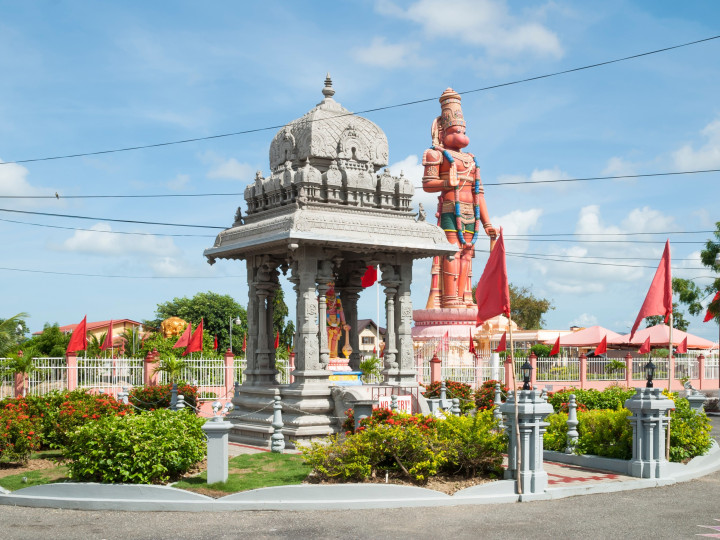 The Hanuman statue in Carapichaima, Trinidad. Photo: Anna Krasnopeeva, Shutterstock. https://www.shutterstock.com/image-photo/hindu-temple-trinidad-1332006812